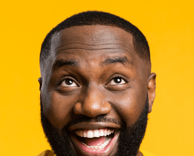 Customer smiling while using the eanvest app to place a stock trade
